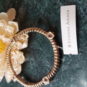 B840 Etienne Aigner Elegant Gold Bangle with Red Accents